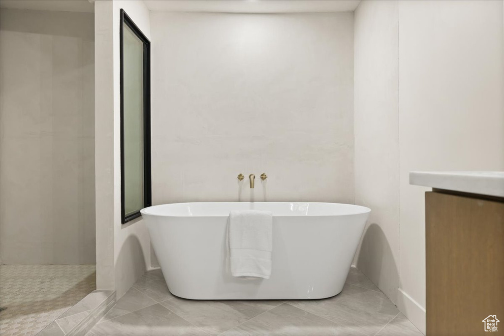 Full bathroom with a freestanding tub and walk in shower