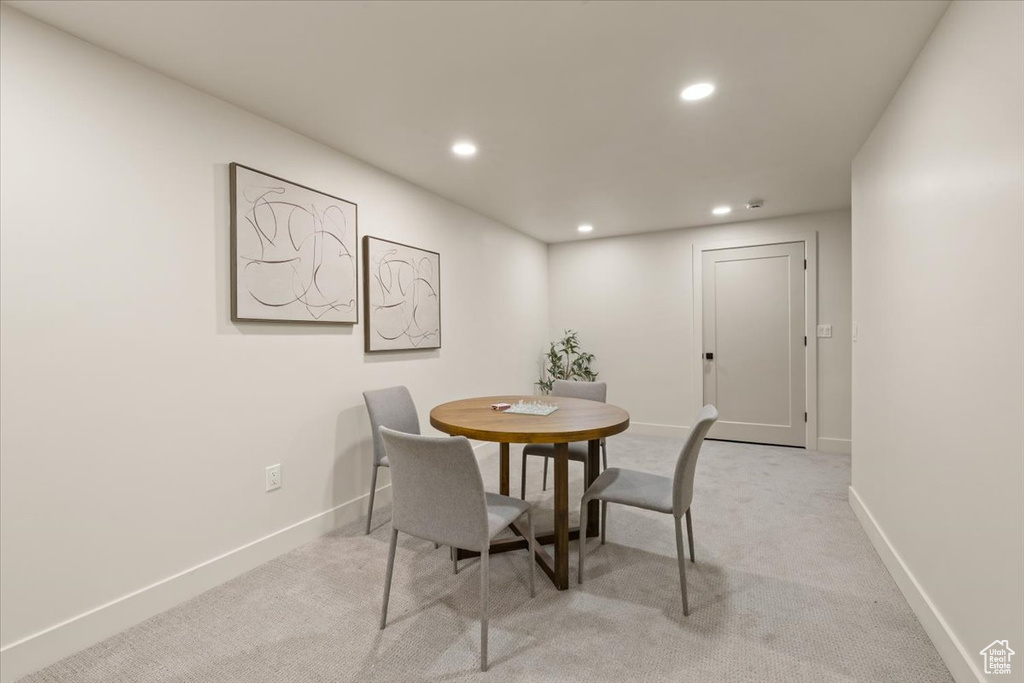 Dining room featuring recessed lighting, baseboards, and light colored carpet