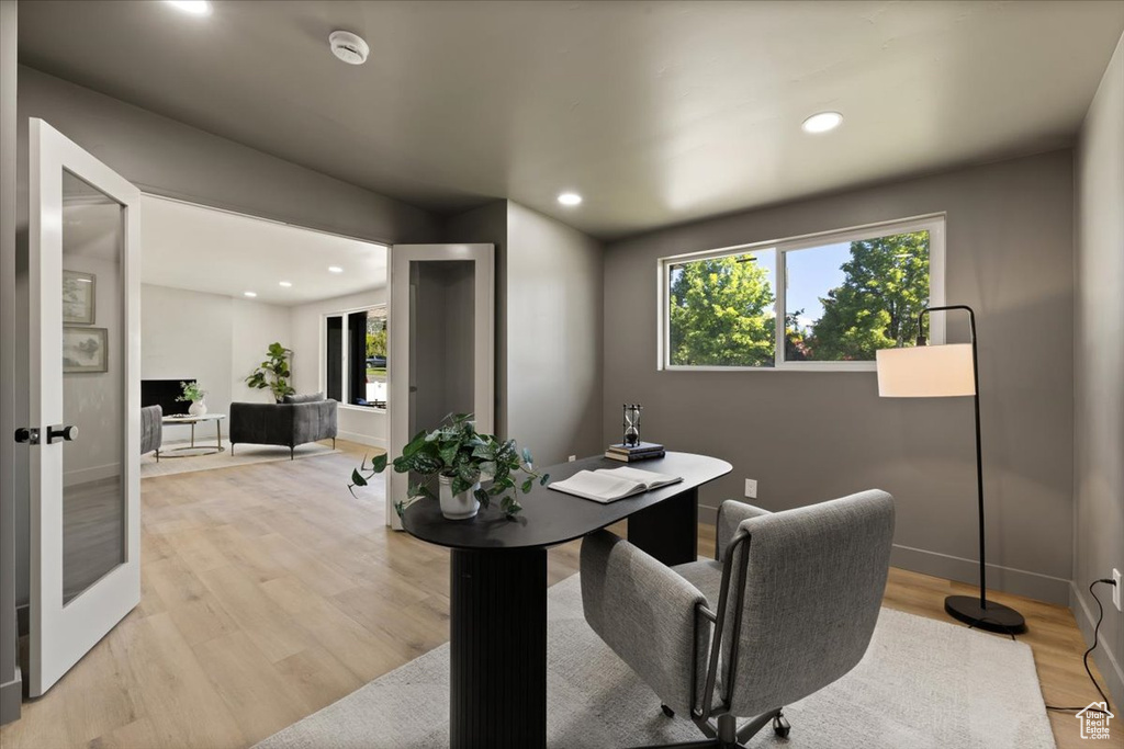Office featuring healthy amount of natural light, recessed lighting, light wood-style floors, and baseboards