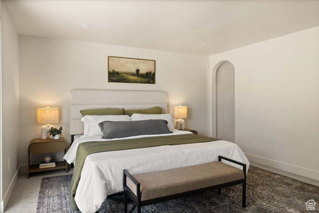 Carpeted bedroom featuring baseboards