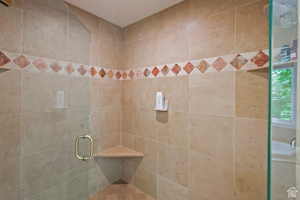 Full bathroom with a shower stall