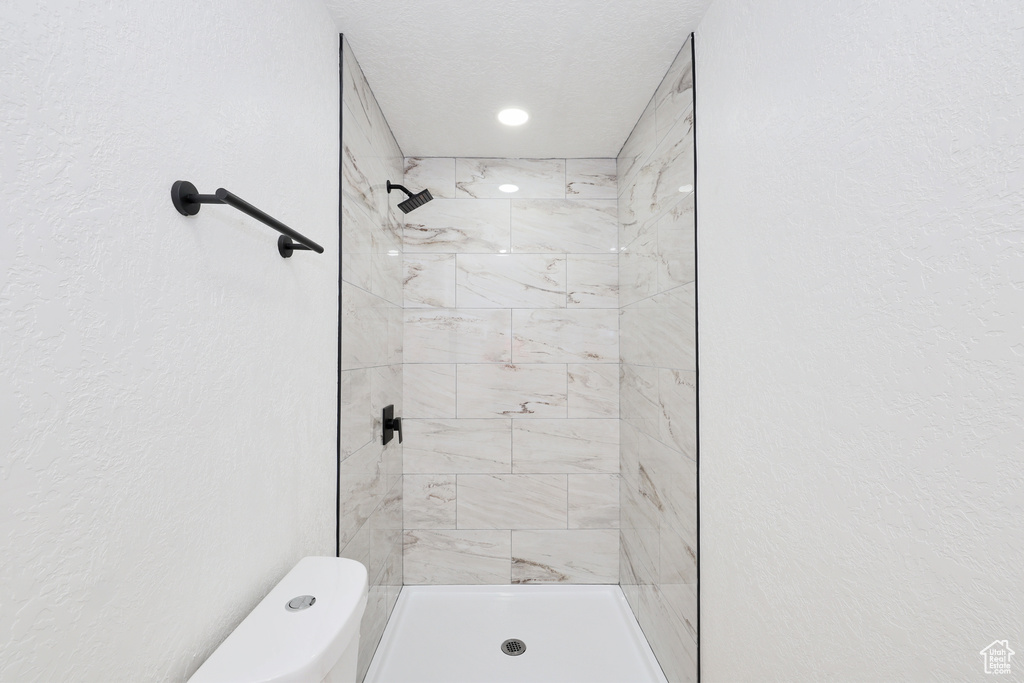 Bathroom with toilet and a shower stall