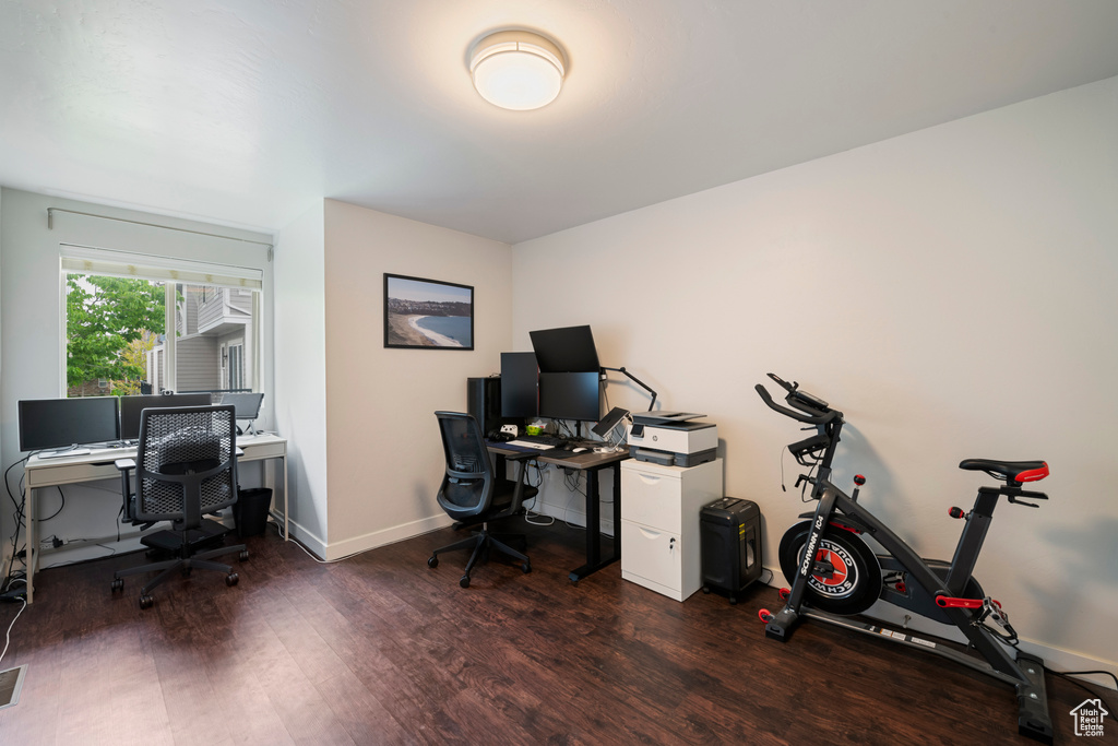 Office area with wood finished floors and baseboards