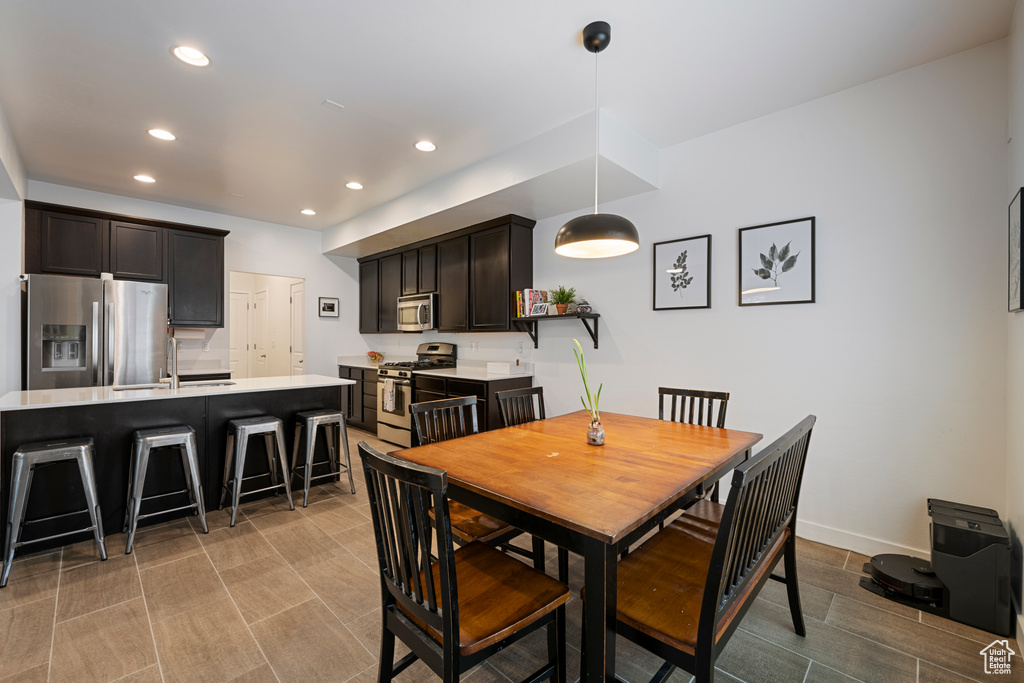 Dining space featuring recessed lighting and baseboards