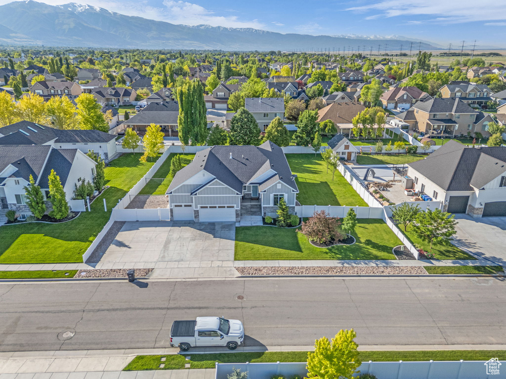 Aerial perspective of suburban area featuring a mountainous background