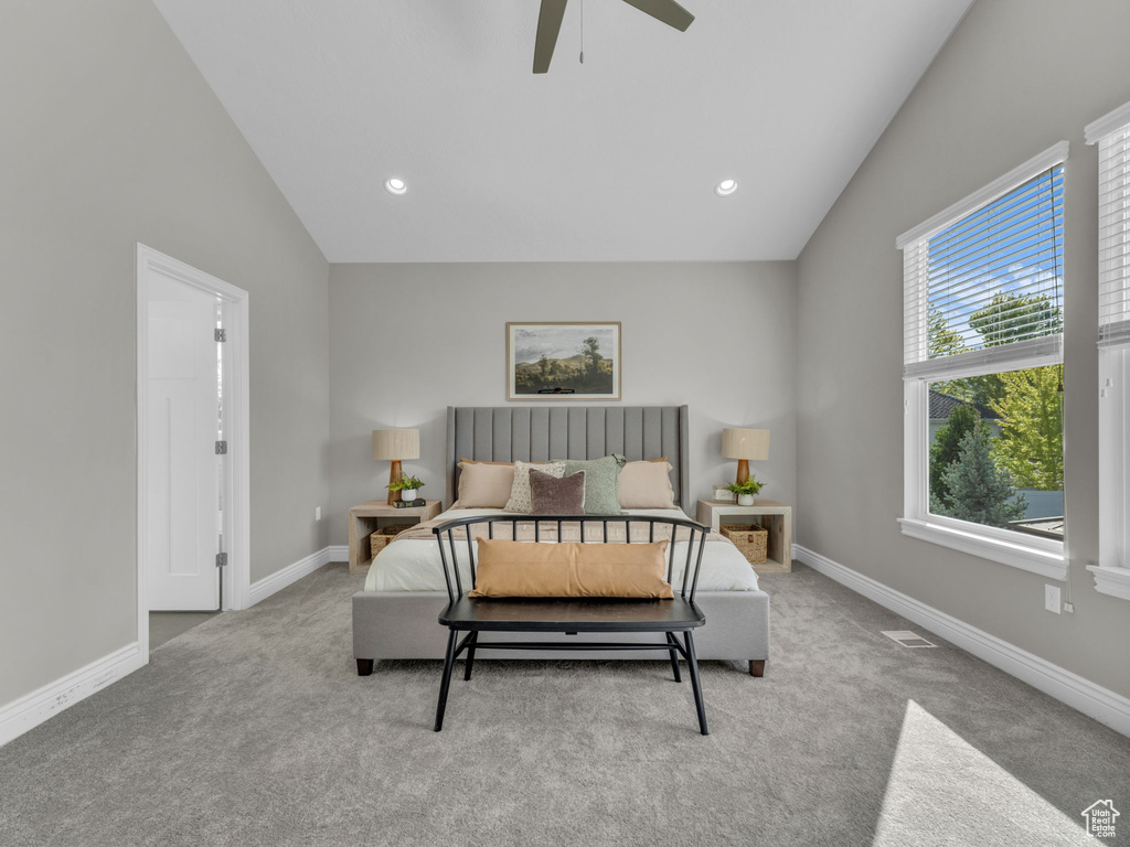 Carpeted bedroom with vaulted ceiling, baseboards, ceiling fan, and recessed lighting