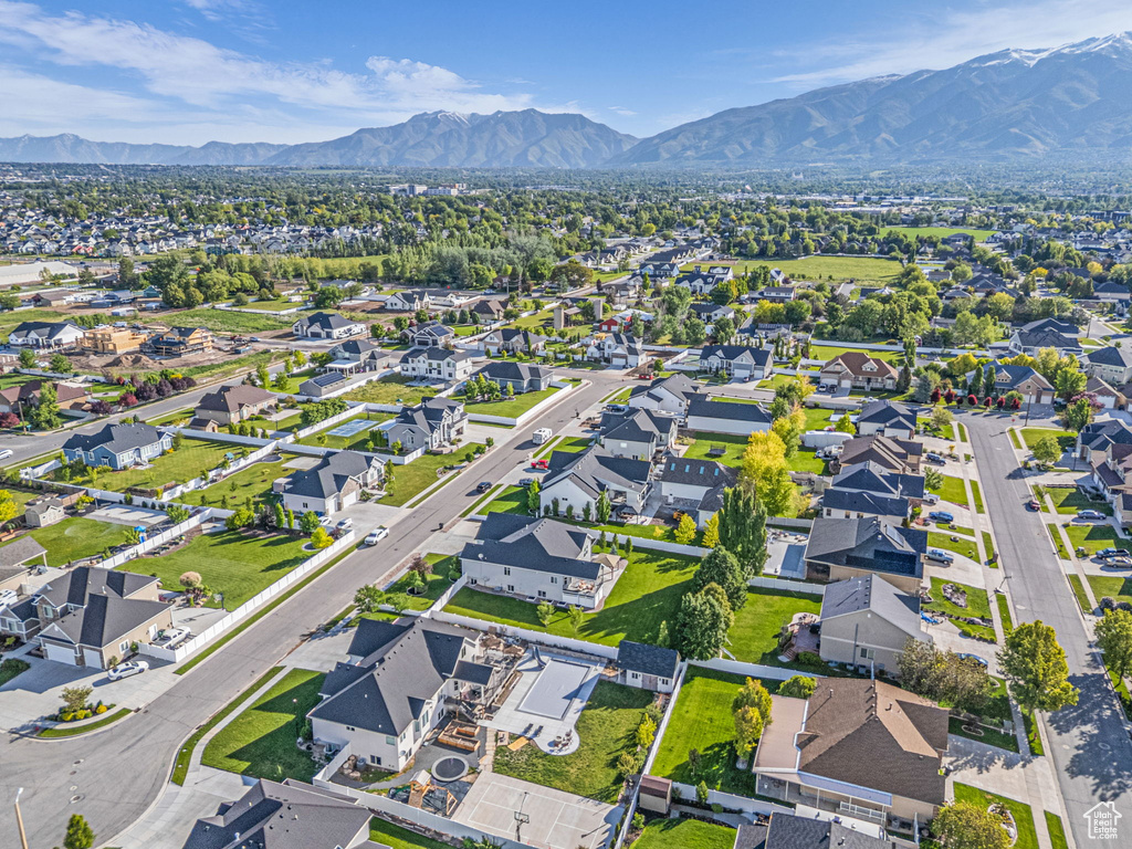 Aerial overview of property\'s location with a mountainous background and nearby suburban area