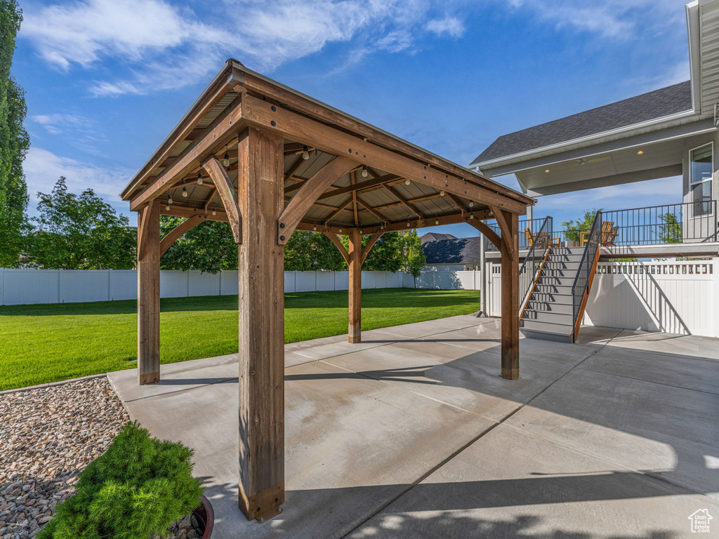 View of patio / terrace featuring stairs and a gazebo