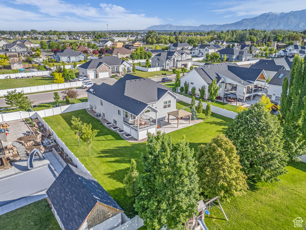 Aerial perspective of suburban area with a mountain backdrop