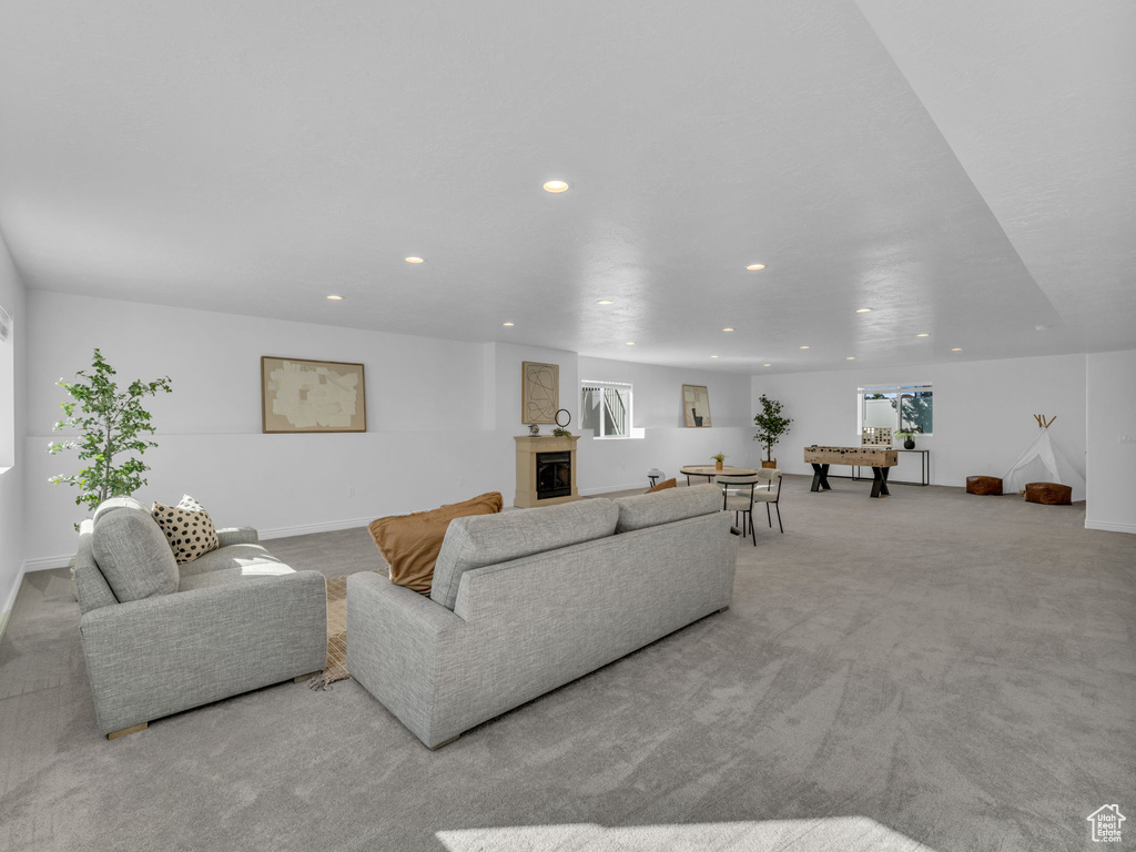 Living room featuring recessed lighting, carpet flooring, and baseboards