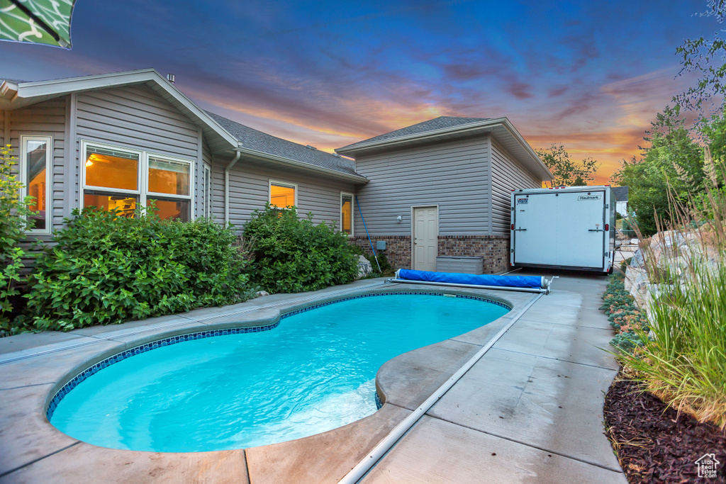 View of swimming pool featuring a patio