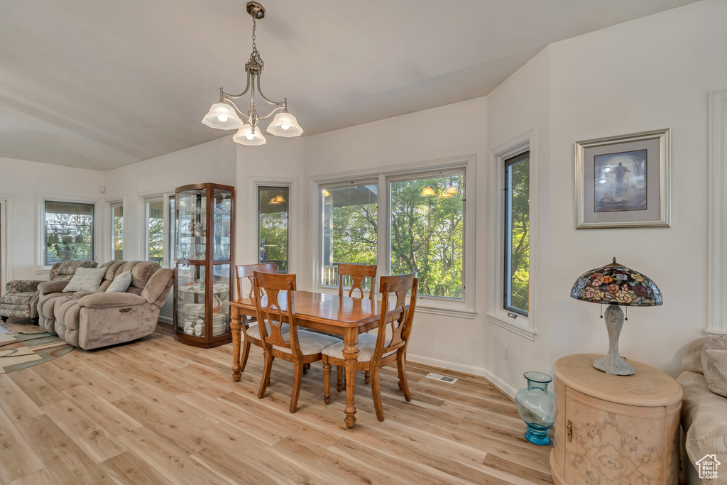 Dining space with light wood-type flooring and baseboards