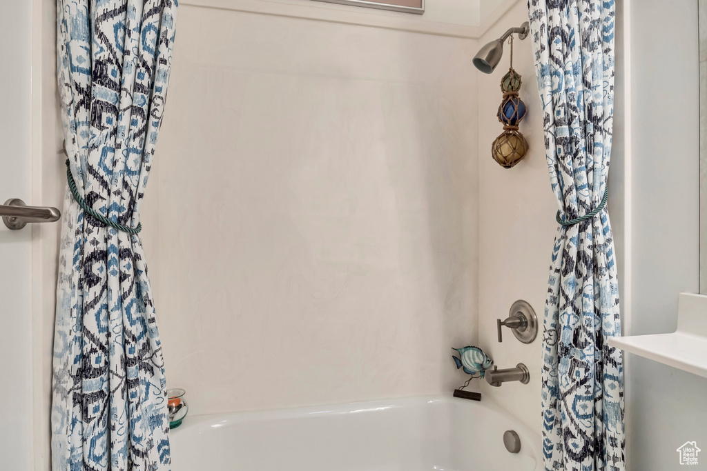 Full bath featuring shower / bath combo
