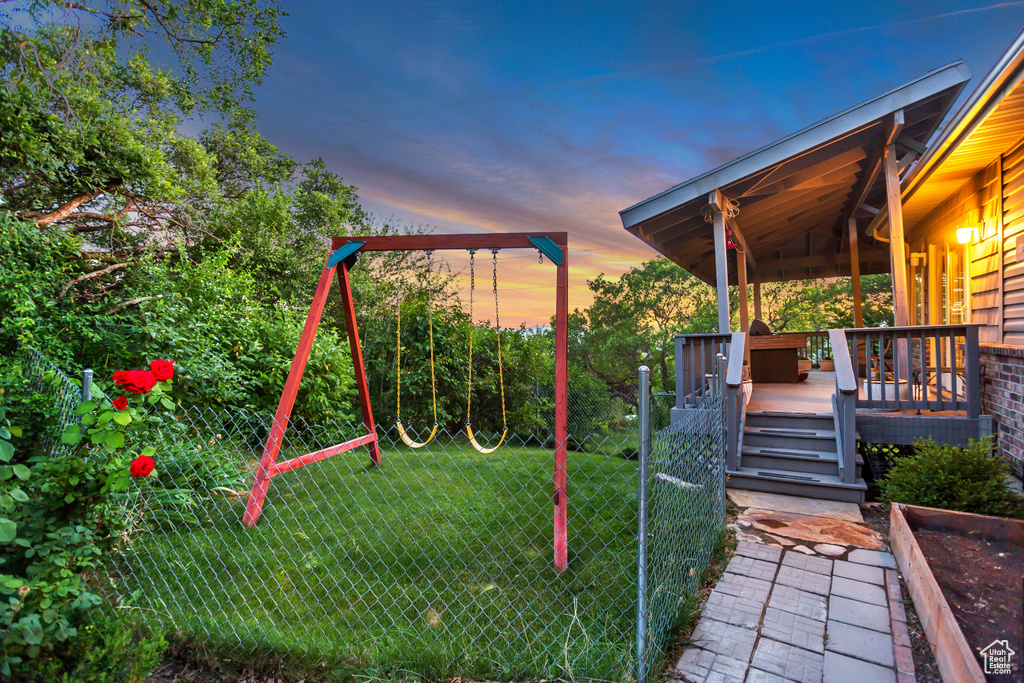 Yard at dusk with a wooden deck