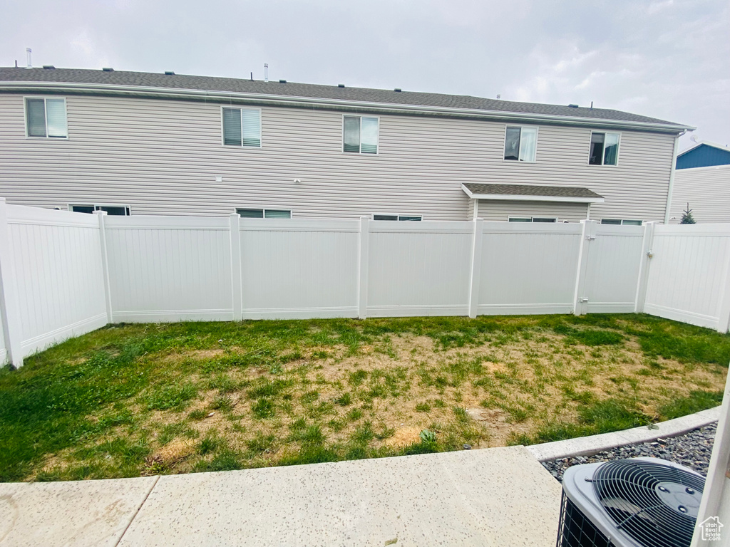 View of yard with central AC unit
