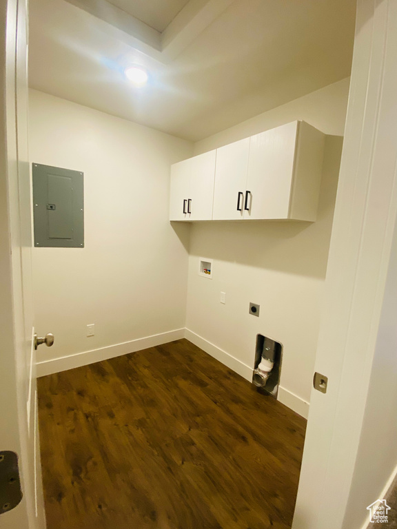 Laundry room featuring electric panel, cabinet space, electric dryer hookup, baseboards, and washer hookup
