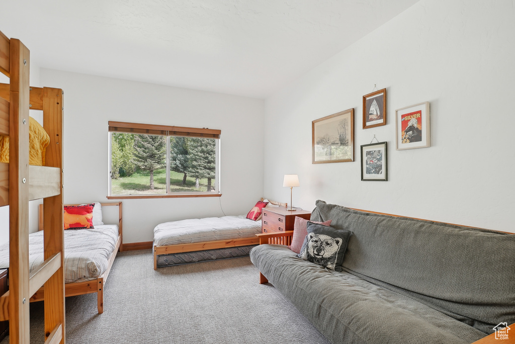 Carpeted bedroom with baseboards