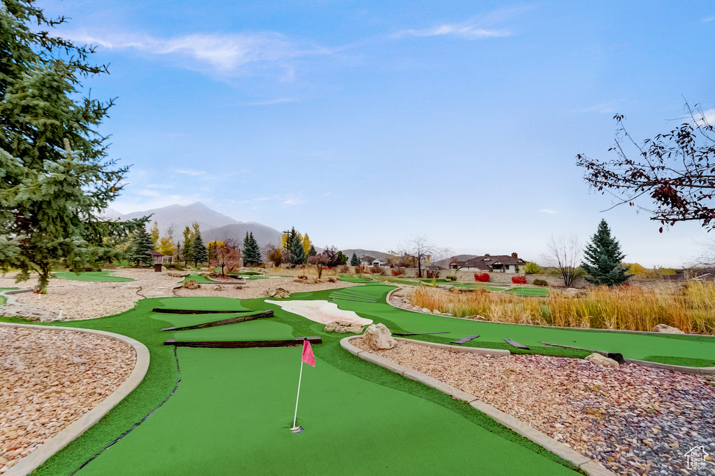 View of home's community with an area to practice putting and a mountain view