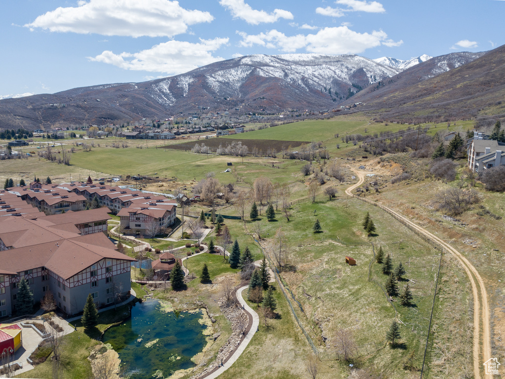 Aerial overview of property's location featuring a mountainous background