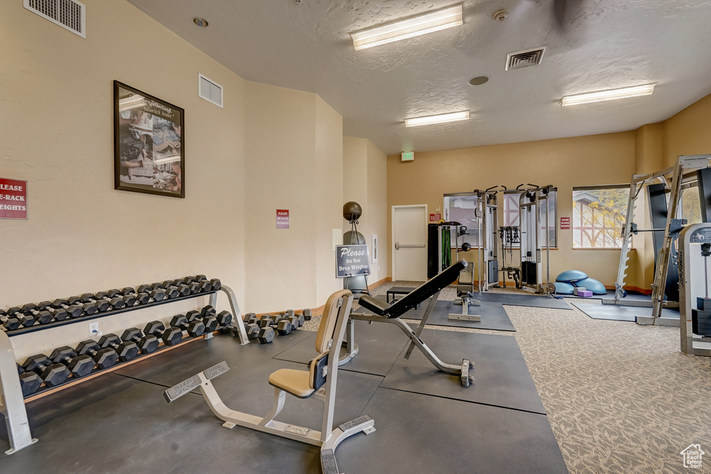Workout area with a textured ceiling