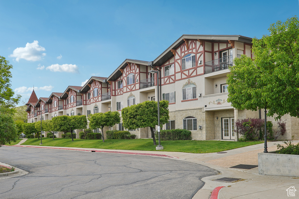 View of property with a residential view