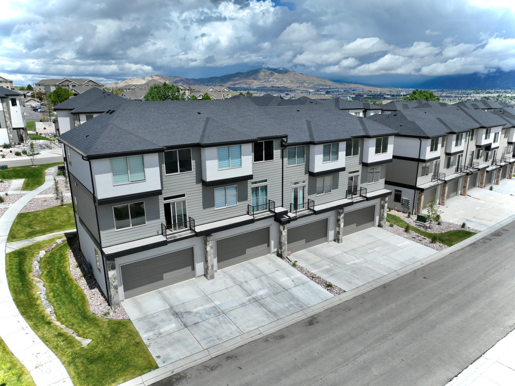 Aerial view of residential area with a mountainous background