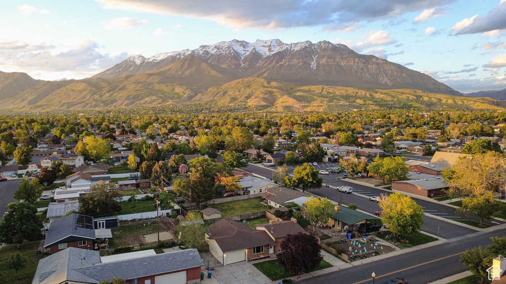 Aerial view of residential area featuring a mountain backdrop