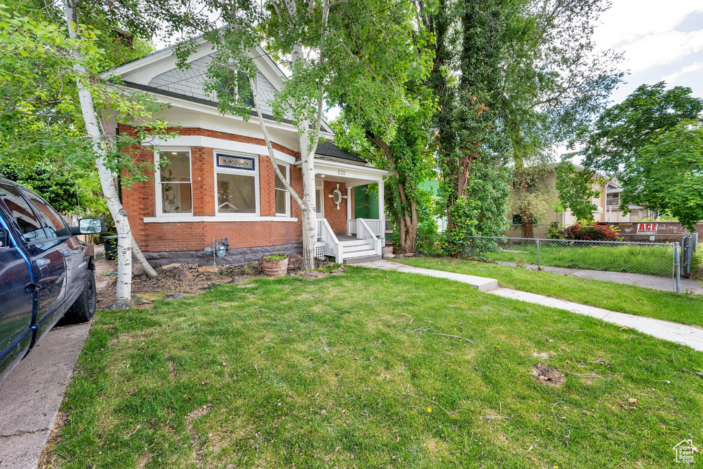 View of front of house with brick siding