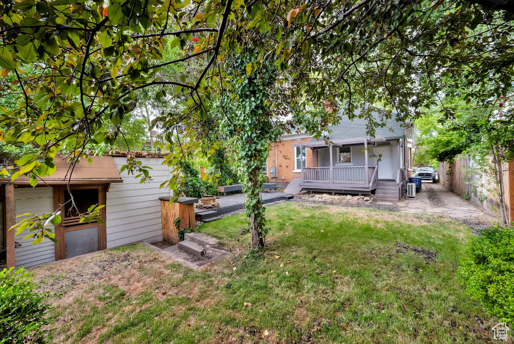 View of yard featuring a wooden deck