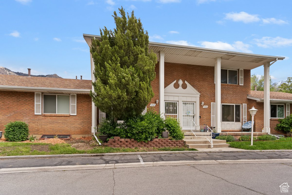 View of front of home with brick siding