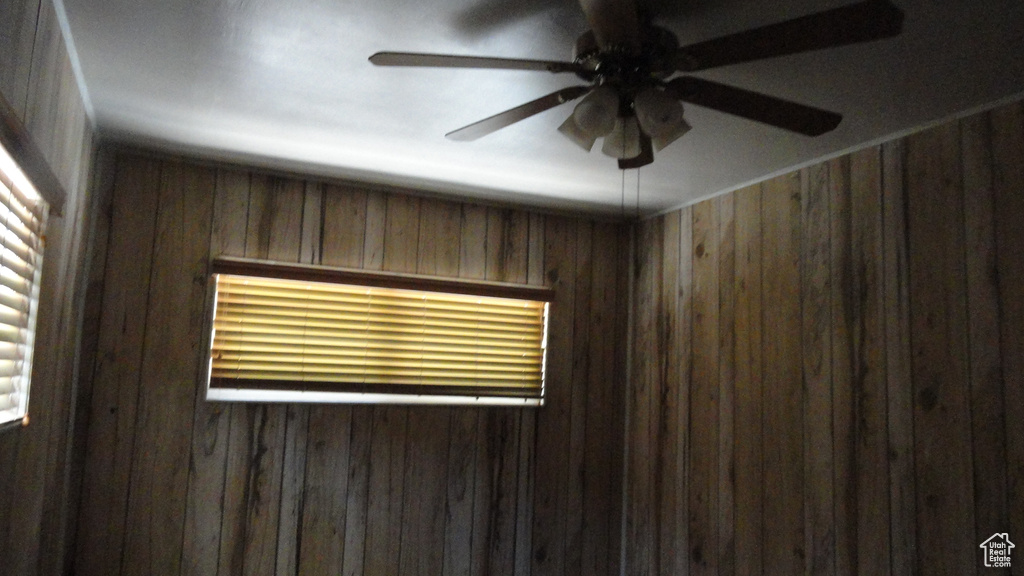 Detailed view of wood walls and ceiling fan