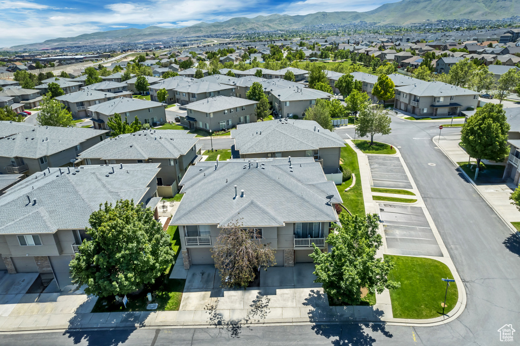 Aerial perspective of suburban area with a mountain backdrop