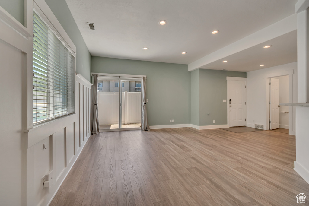 Unfurnished room featuring recessed lighting, light wood-style flooring, and baseboards