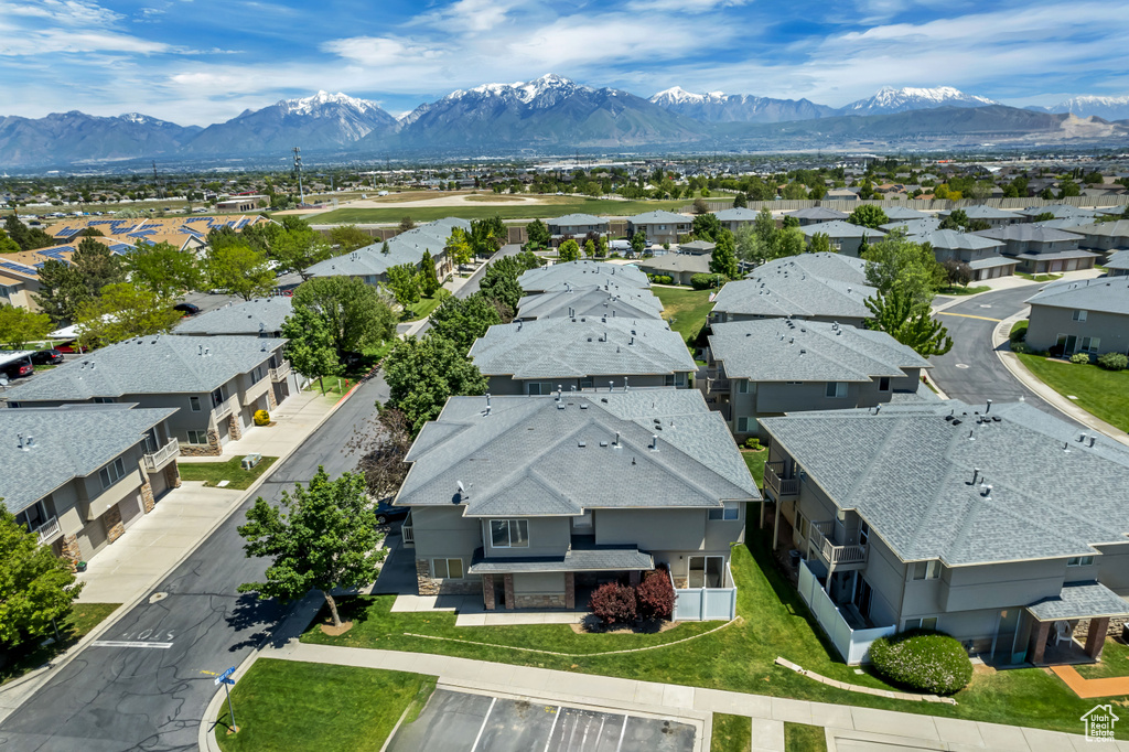 Aerial view of residential area featuring a mountainous background