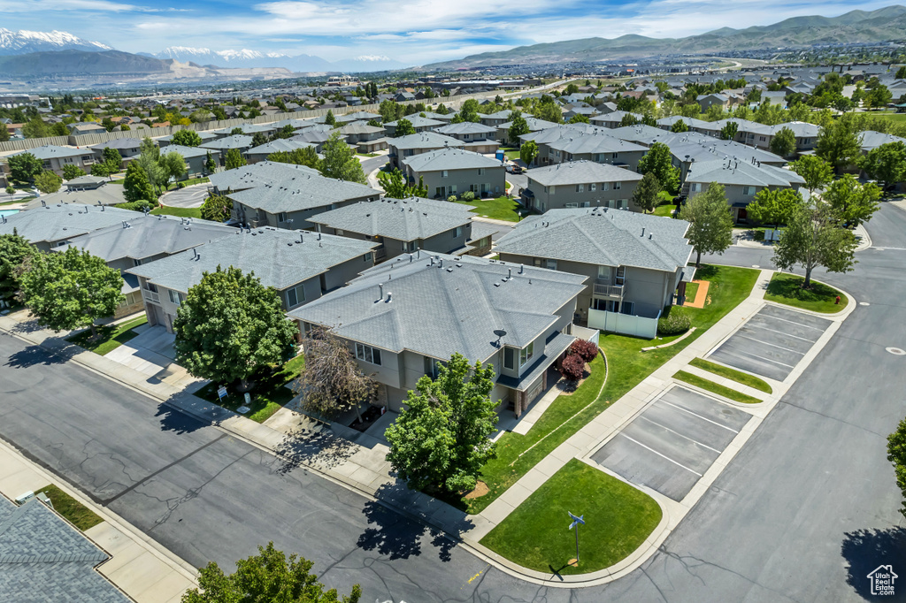 Aerial view of residential area featuring a mountain backdrop