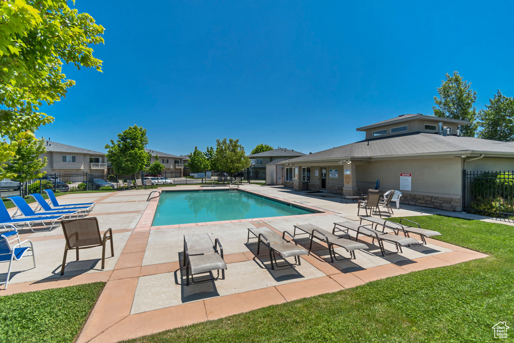 Community pool featuring a patio area