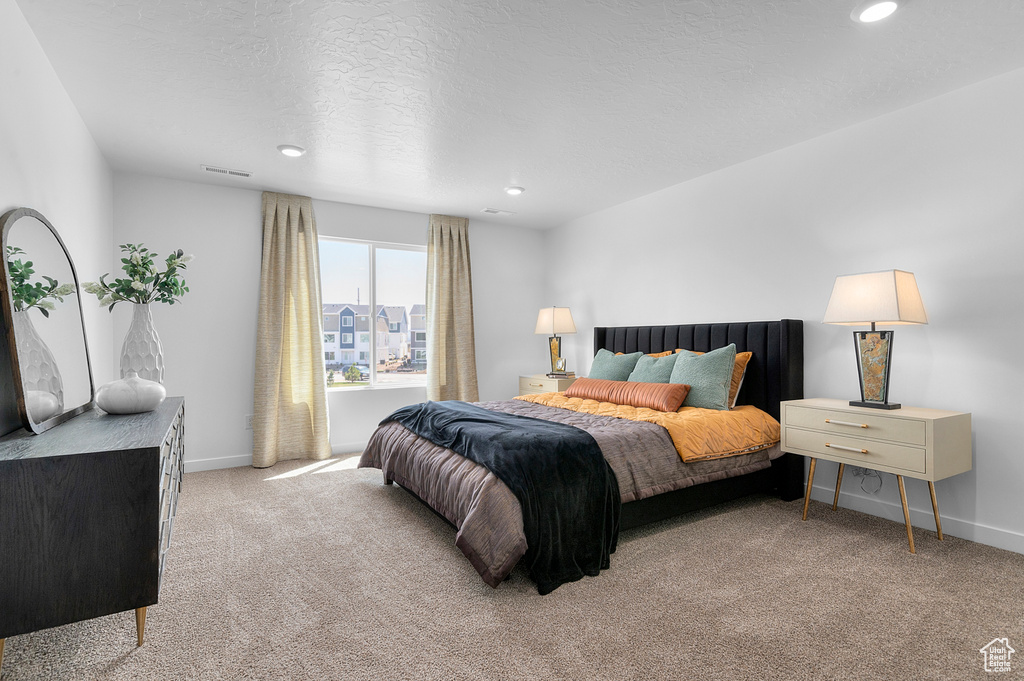 Carpeted bedroom featuring baseboards and recessed lighting