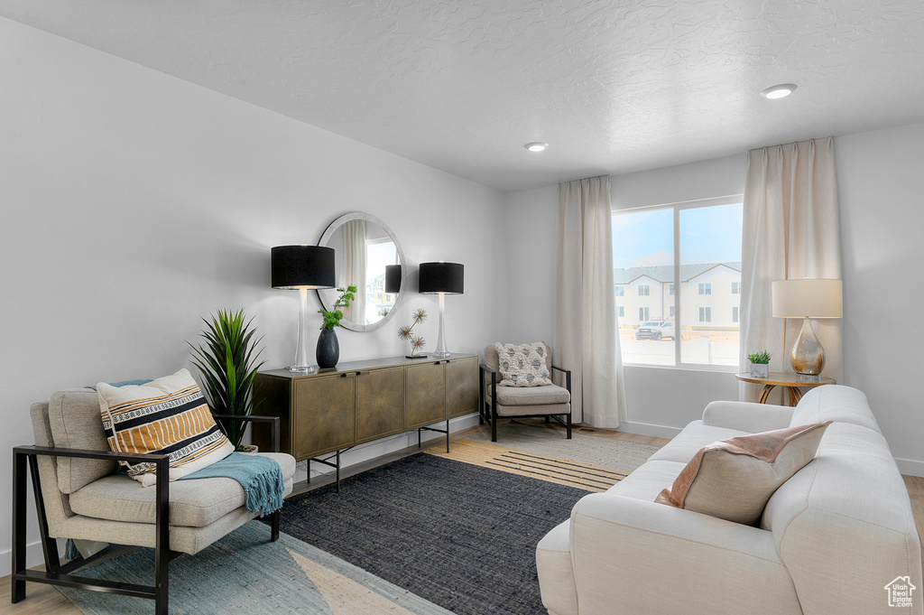 Living room with baseboards and recessed lighting