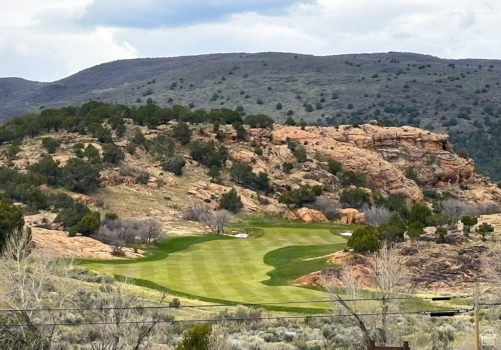 View of mountain backdrop featuring a golf course