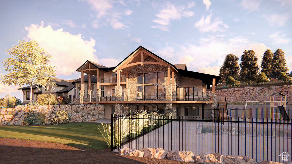 View of side of property featuring stone siding and a balcony