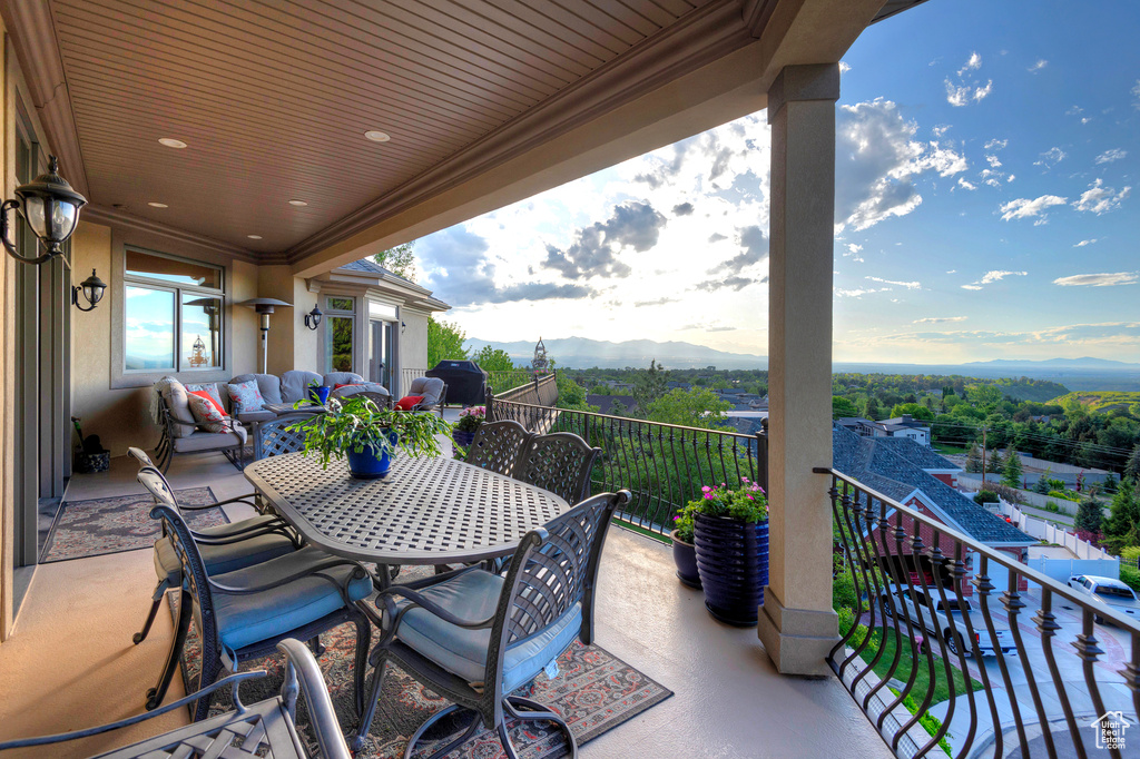 View of patio / terrace featuring a mountain view and a balcony