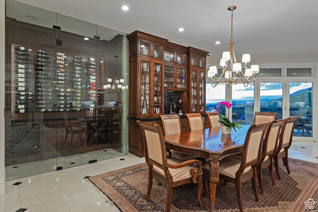 Dining space featuring a chandelier, recessed lighting, and light tile patterned floors
