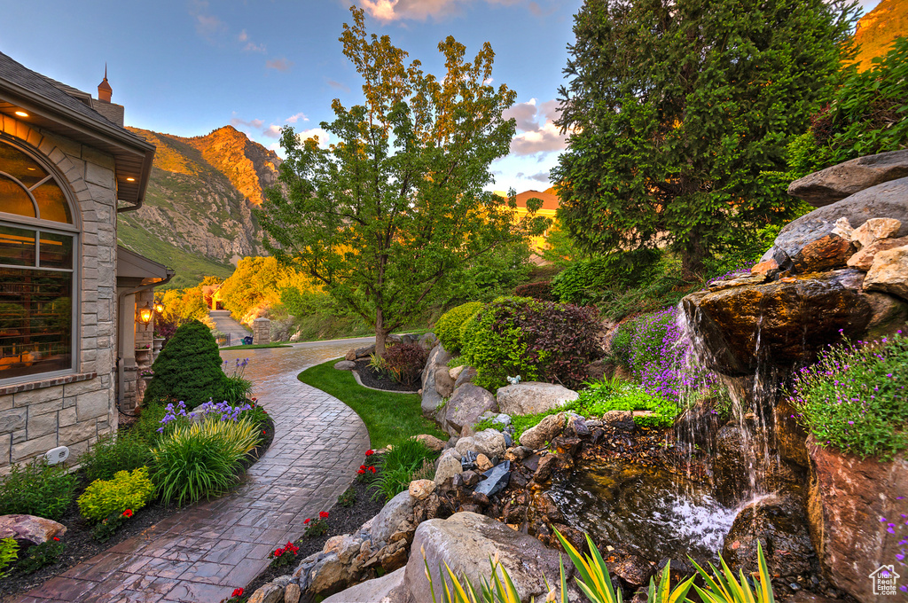 Yard at dusk with a mountain view