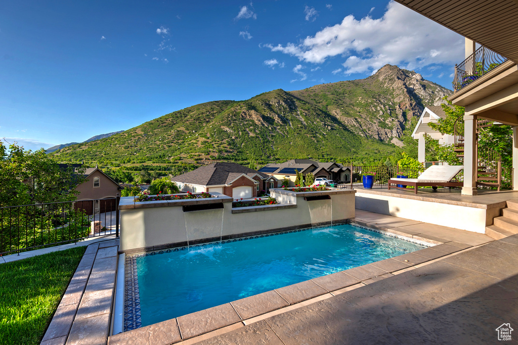 View of pool featuring a mountain view