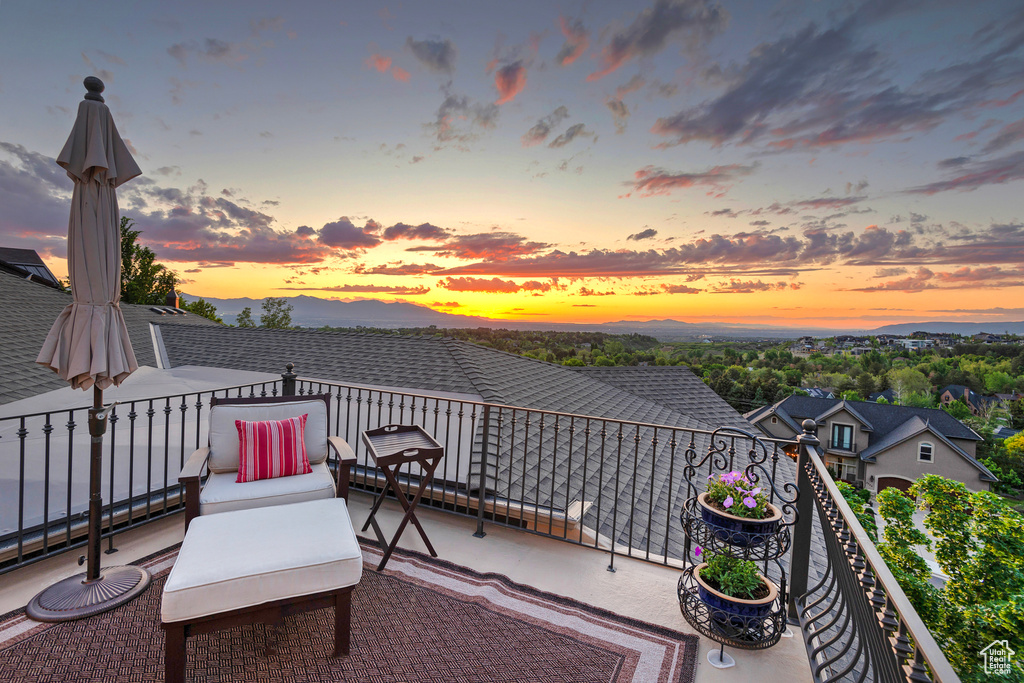 Patio terrace at dusk with a balcony