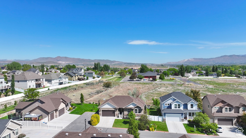 Aerial view of residential area with a mountainous background