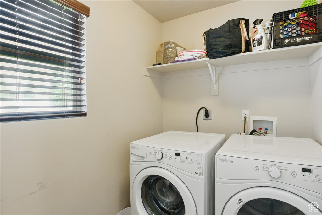 Washroom featuring independent washer and dryer