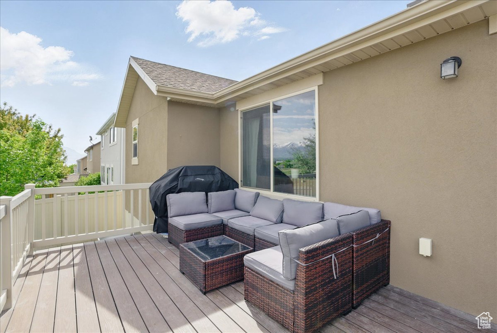Wooden terrace featuring outdoor lounge area