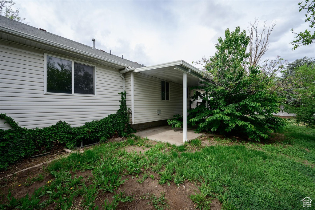 Back of property with a patio area
