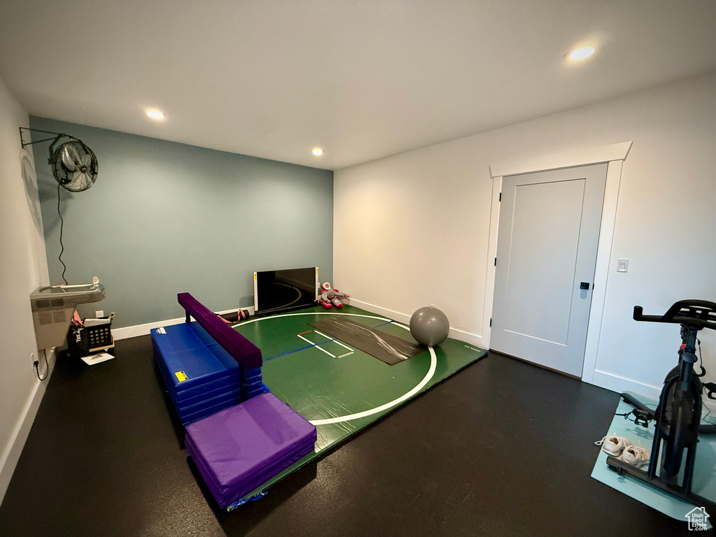 Game room featuring baseboards, recessed lighting, and rubber floors